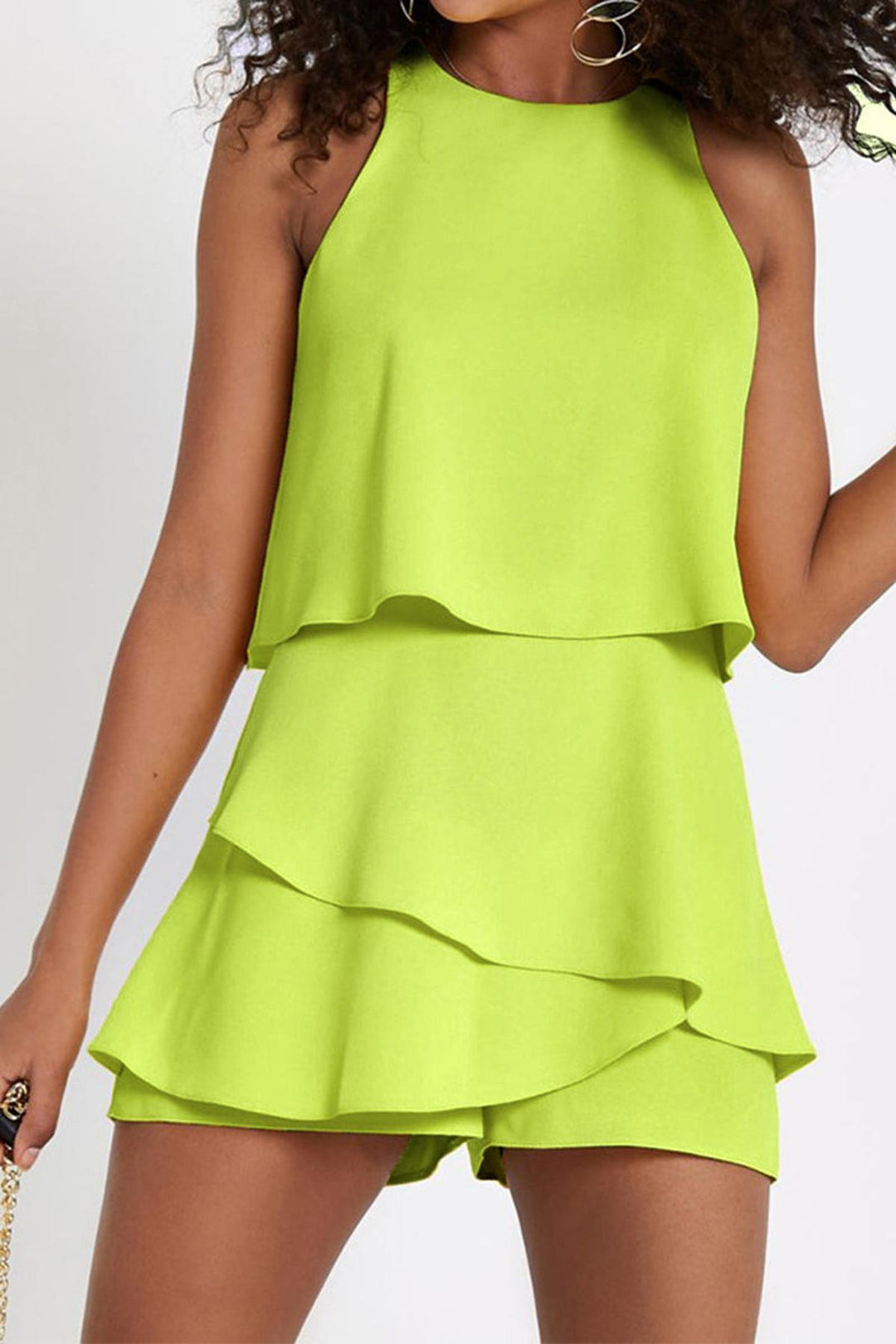 Stylish women's sleeveless one-piece romper with playful ruffles. Perfect casual summer outfit for various occasions.
