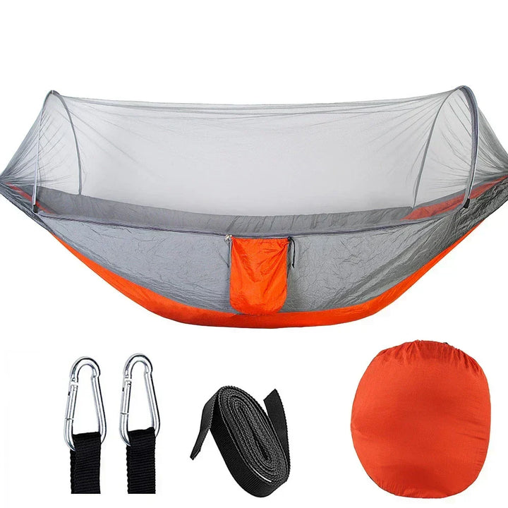 Versatile unisex outdoor hammock with built-in mosquito net, perfect for camping, travel, and serene relaxation.