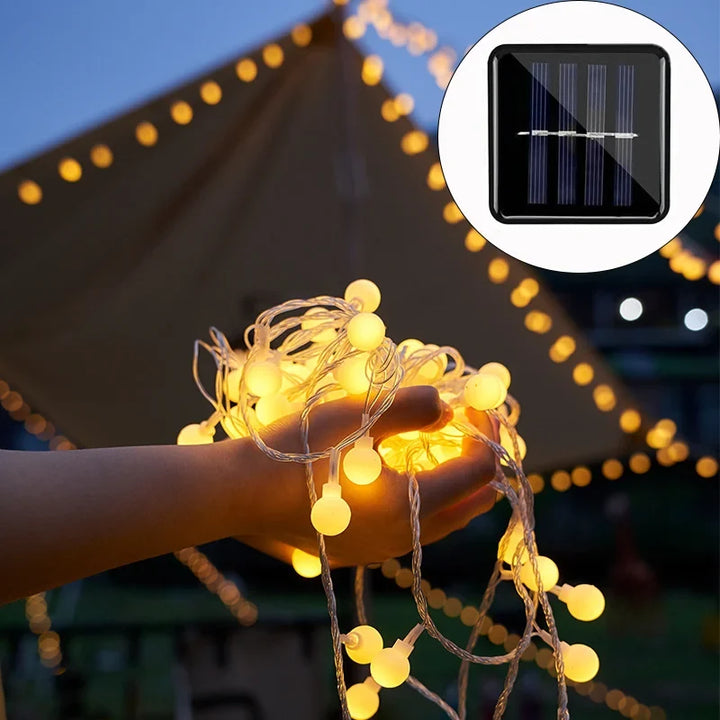 Warm white solar LED string lights for outdoor patio & garden decor, eco-friendly & waterproof.