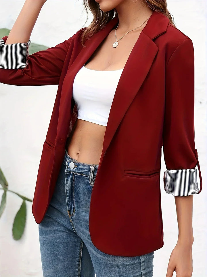 Tailored women's blazer, offering modern elegance for professional wear, business meetings & office style.