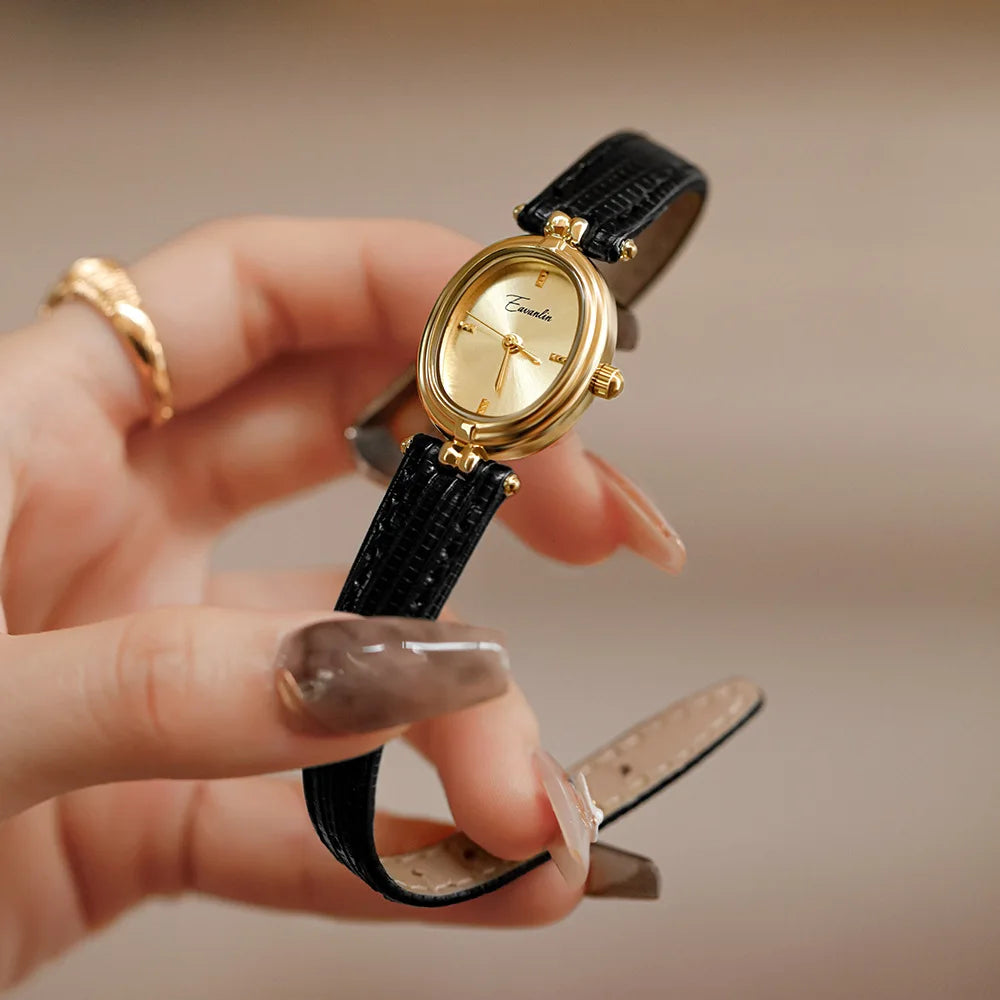 Classic women's quartz watch featuring a stylish brown leather strap and gold-tone accents.