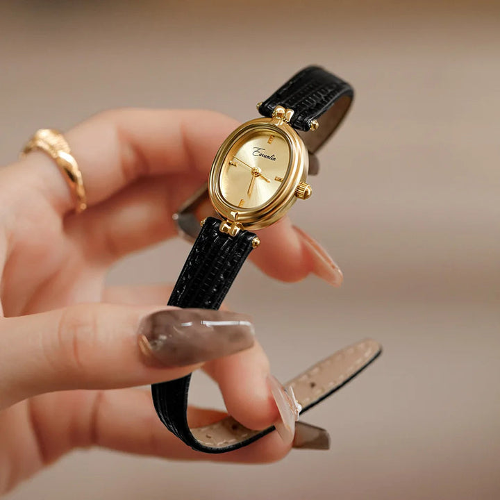 Classic women's quartz watch featuring a stylish brown leather strap and gold-tone accents.