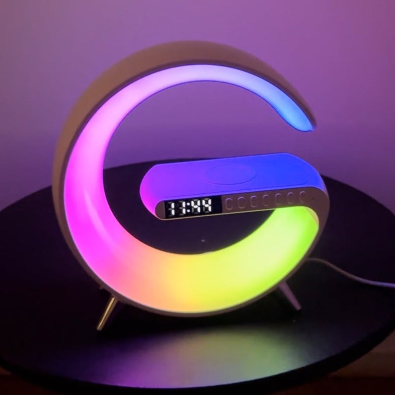 Stylish Nvroome Light: wireless phone charger, quality RGB speaker, & clear digital clock. Perfect desktop tech organizer.
