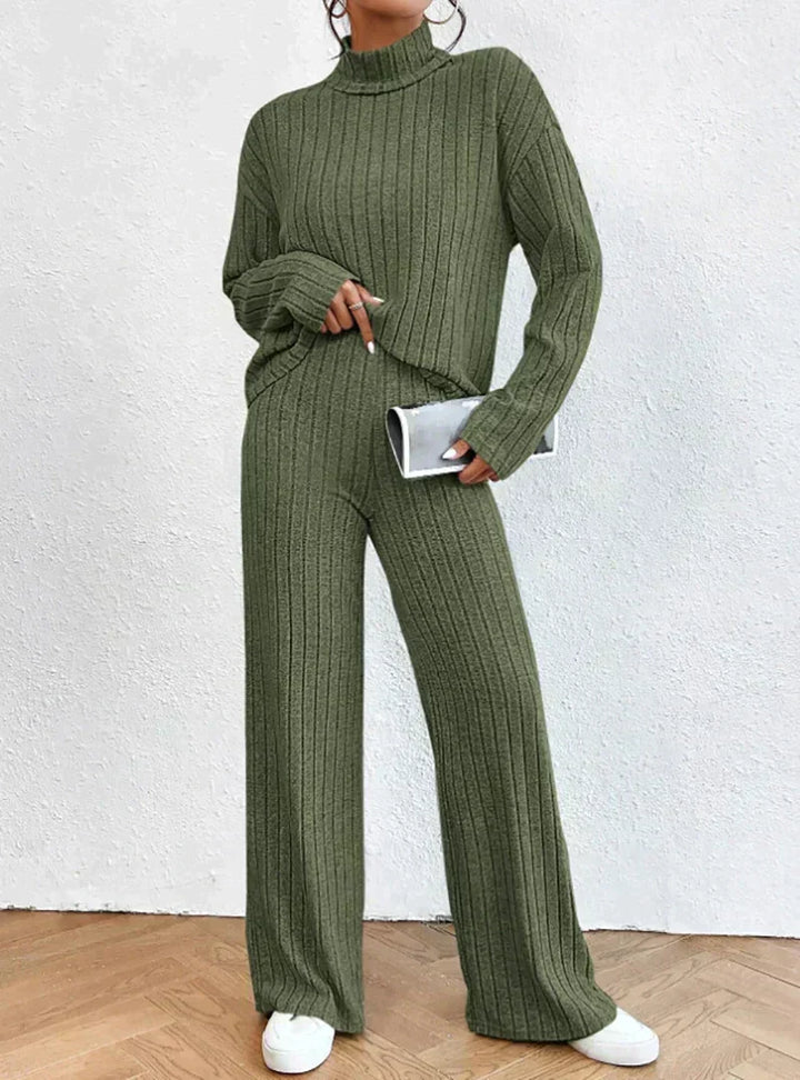 Complete women's matching ribbed loungewear set featuring a warm turtleneck and relaxed fit pants. Fall fashion.