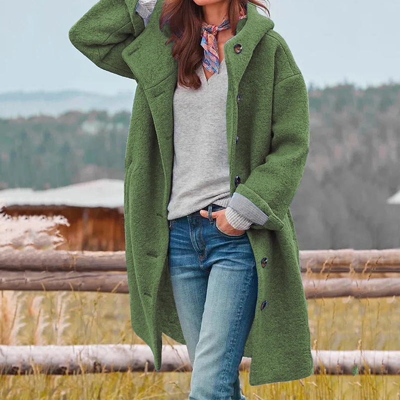 Back view of a women's elegant long winter coat, highlighting its graceful silhouette and sophisticated style.