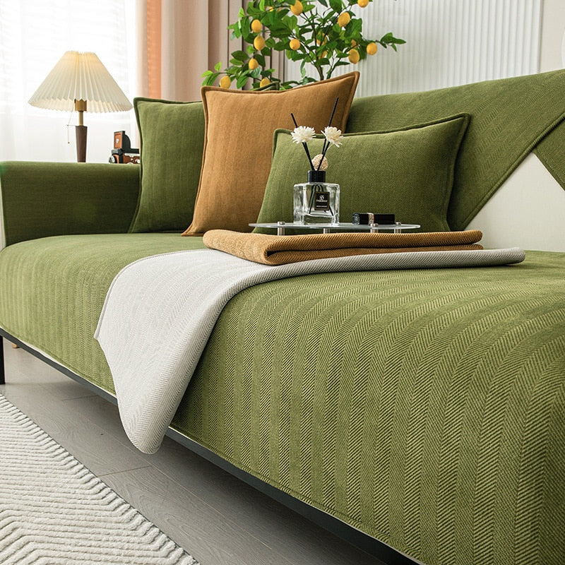 Grey non-slip couch protector made from soft chenille, ideal for pet-friendly living rooms.