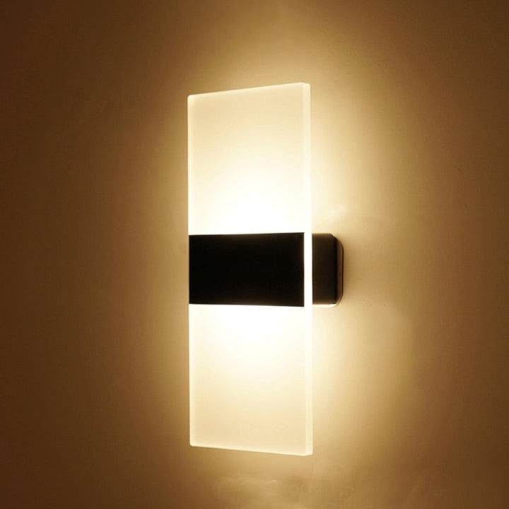 Ambient LED wall sconce with smart motion & touch sensors, modern design for stylish home lighting.
