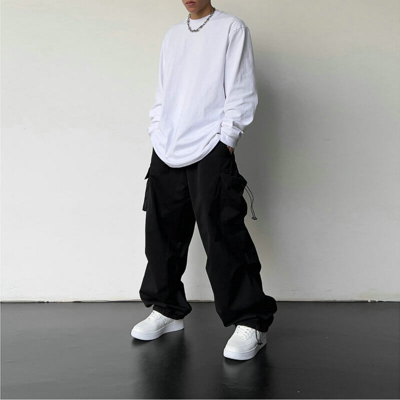 Close-up of pocket detail on unisex cargo joggers, highlighting functional design & quality.