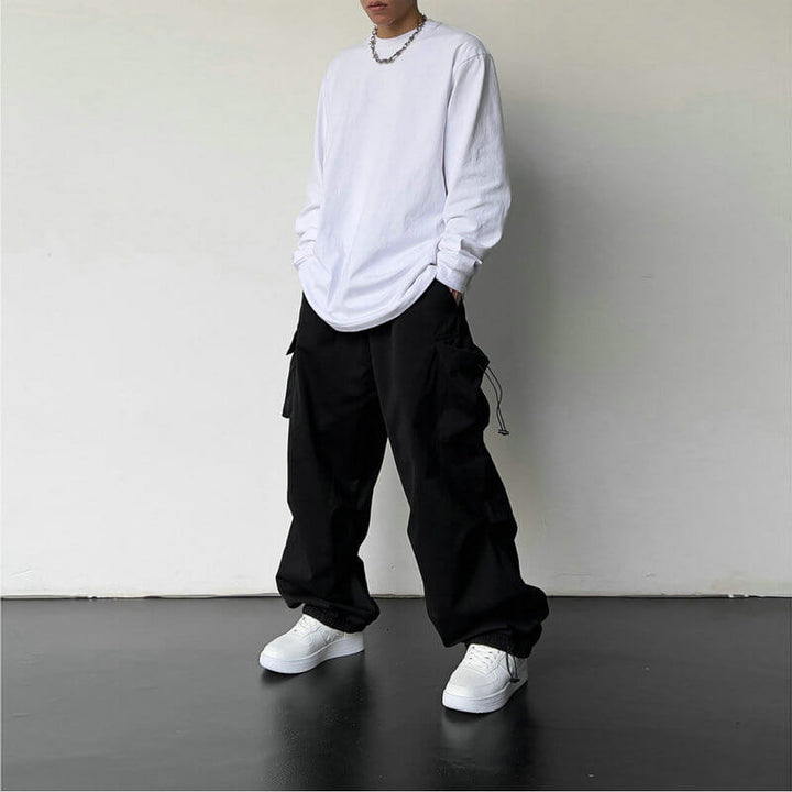 Close-up of pocket detail on unisex cargo joggers, highlighting functional design & quality.