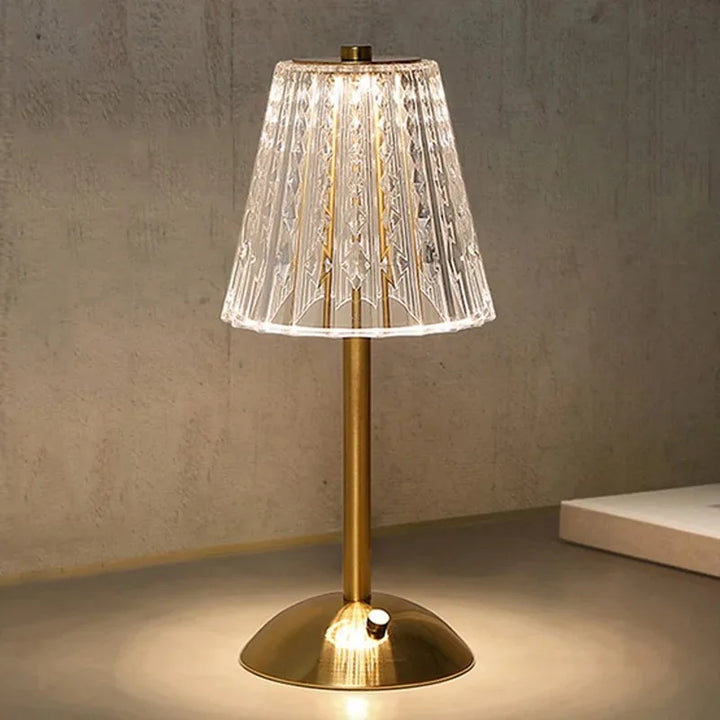Rechargeable LED crystal table lamp for portable ambient lighting, elegant gold base.