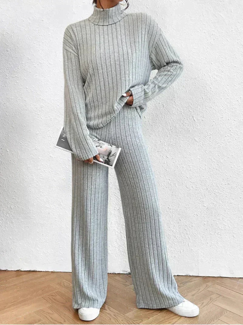 Close-up of a cozy women's ribbed turtleneck top from a two-piece loungewear set. Everyday chic.