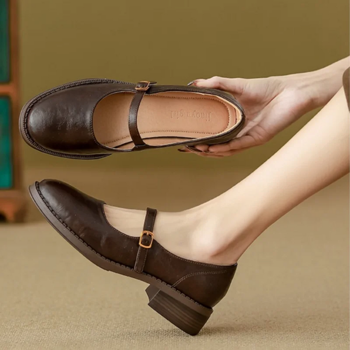 Women's classic black Mary Jane flats with adjustable strap & cushioned comfort, perfect for everyday elegant wear.