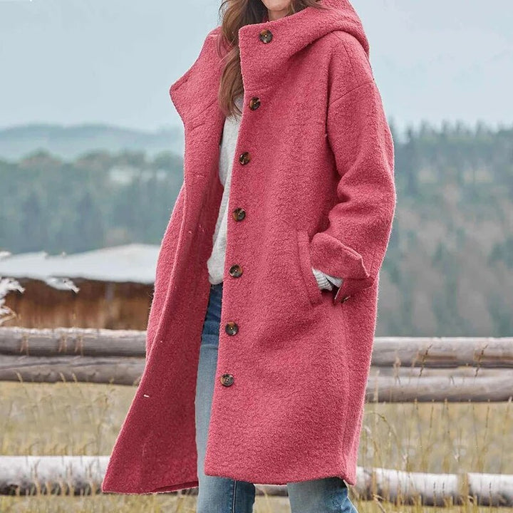 Close-up of a stylish women's elegant winter coat, showing soft fabric texture and quality tailoring for warmth.