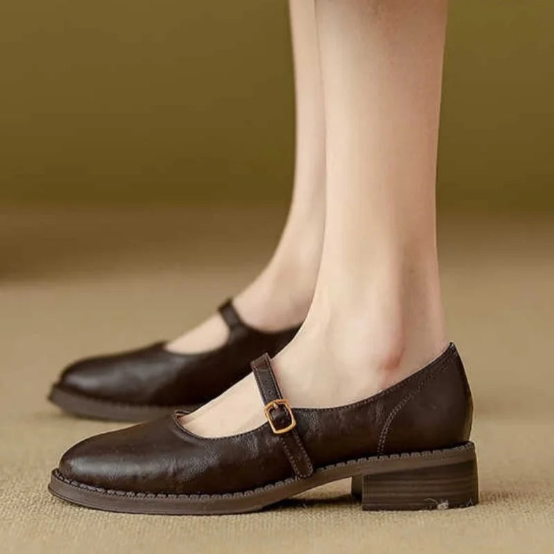 Cushioned women's classic Mary Jane flats, featuring a comfortable low heel and adjustable strap for all-day wear.
