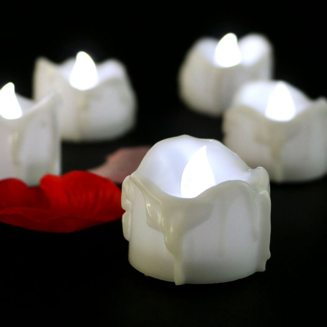 Romantic flameless LED candles, 12-pack, flickering for beautiful event & tabletop decor. Safe & battery-operated.