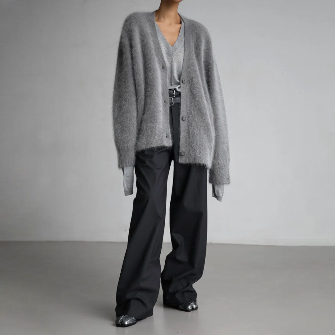 Cozy women's long sleeve knit cardigan, perfect for layering. Comfortable and chic knitwear.