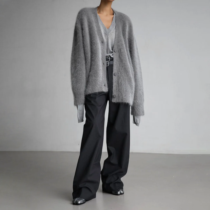 Cozy women's long sleeve knit cardigan, perfect for layering. Comfortable and chic knitwear.