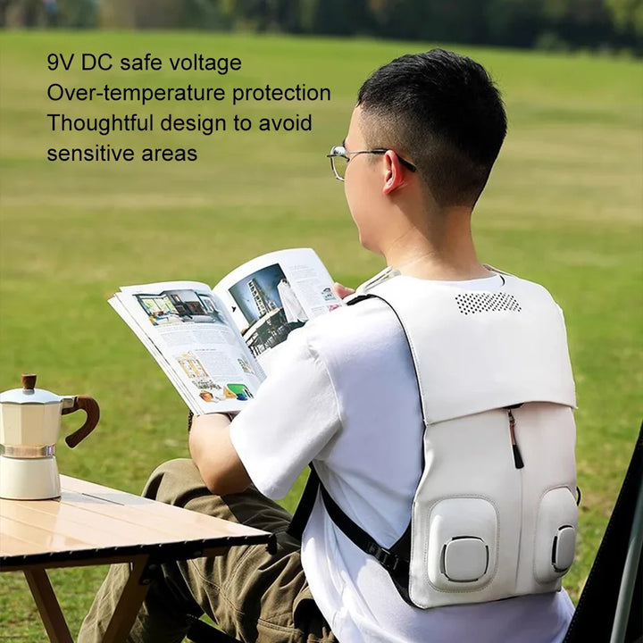 Person wearing a grey cooling vest with fans outdoors, ideal for summer heat relief & active comfort.