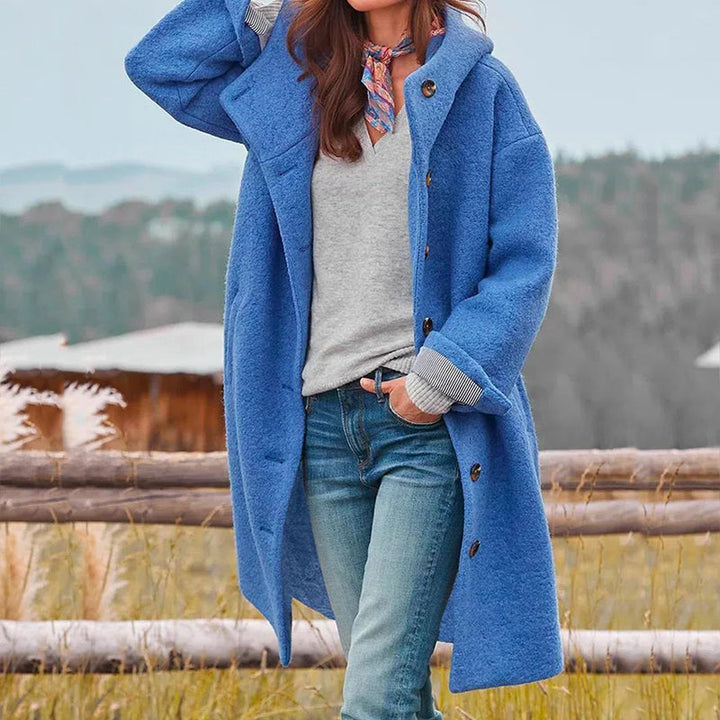Woman wearing a chic, warm women's elegant long winter coat, showcasing versatile fall & winter fashion.