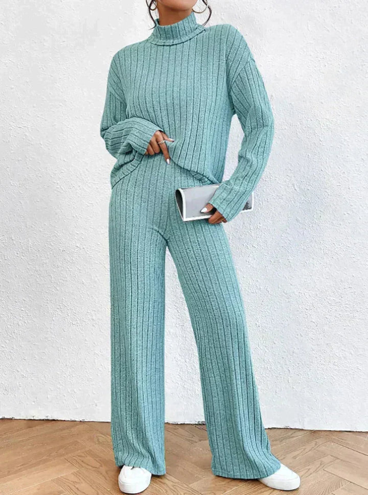 Stylish women's two-piece ribbed loungewear set with turtleneck, ideal for comfortable relaxed fit casual wear.