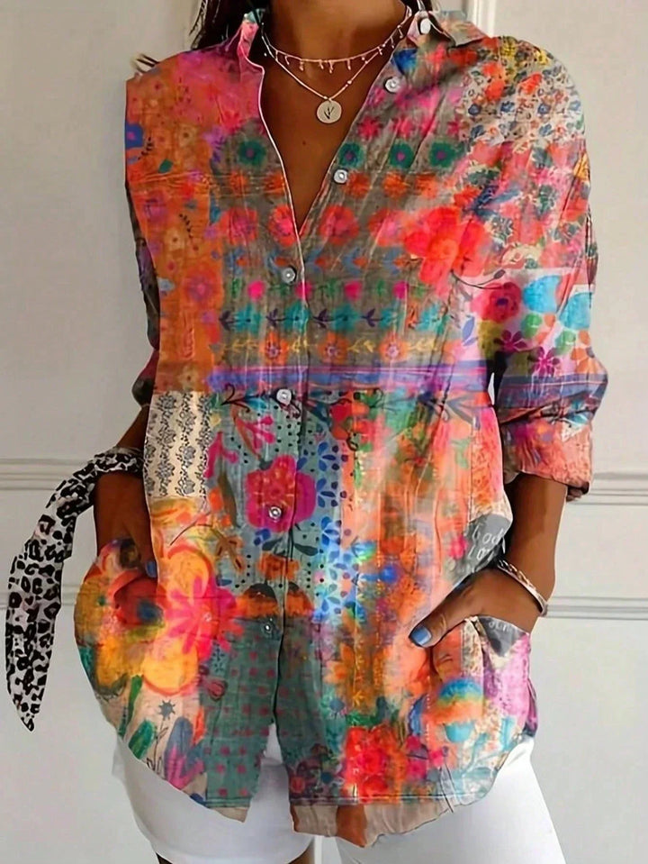 Vibrant abstract print women's blouse. Stylish button-front, long sleeve. Perfect versatile top for summer fashion.