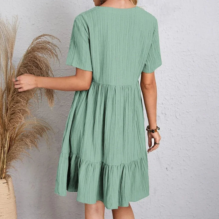 Chic Adeline V-neck summer dress. Flowy, elegant midi for women, perfect for warm weather and versatility.