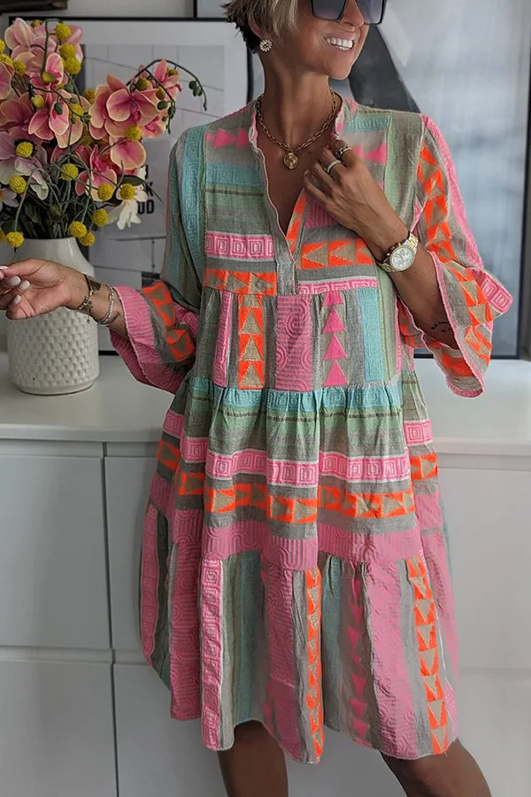 Flowy women's A-line spring dress featuring delicate ruffles and a flattering short length in pink.