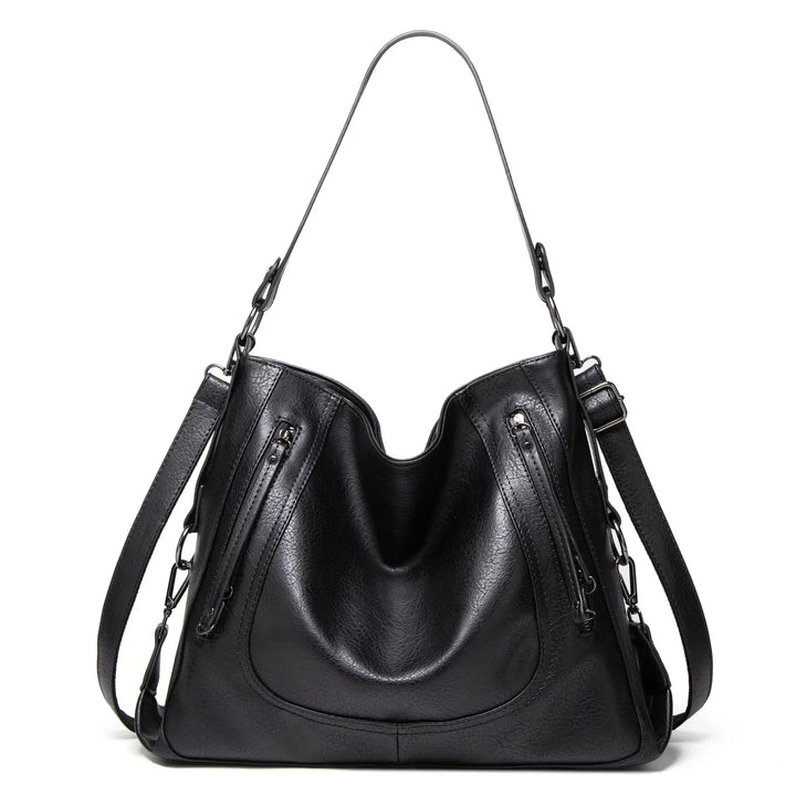 Black women's vintage leather shoulder bag, a versatile everyday handbag for stylish fashion accessory.