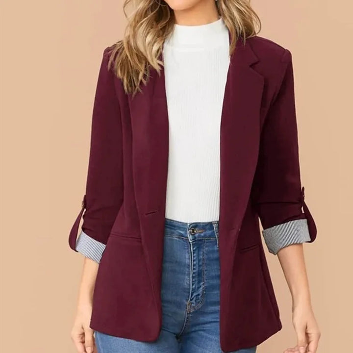 Women's business attire blazer. A modern, tailored single-breasted jacket for professional elegance.