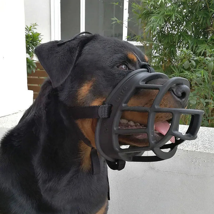 Secure adjustable dog muzzle made from soft silicone, perfect for chew prevention, anti-bark control & safety.
