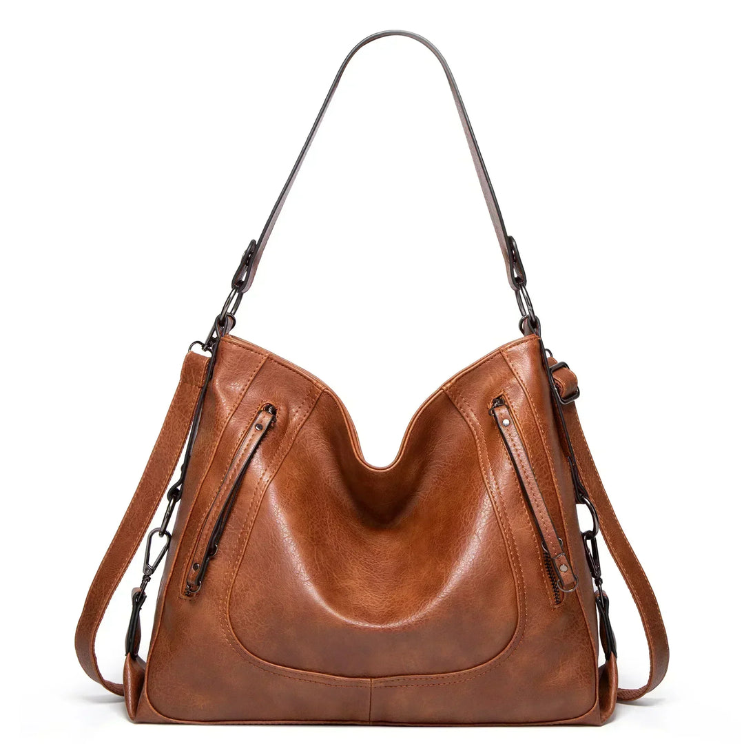 Women's vintage style leather shoulder bag, spacious & stylish everyday handbag. Premium quality fashion accessory.