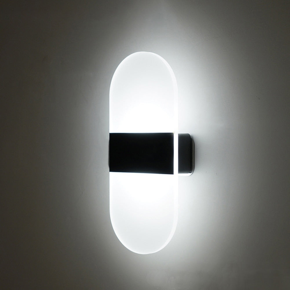 Modern smart sensor LED sconce, rechargeable wall light with magnetic mount for convenient indoor decor.