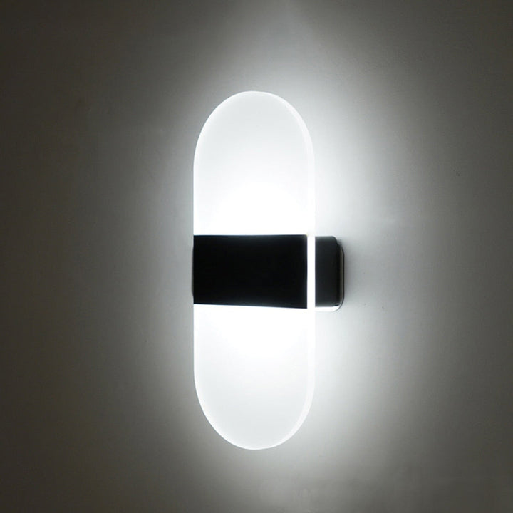 Modern smart sensor LED sconce, rechargeable wall light with magnetic mount for convenient indoor decor.