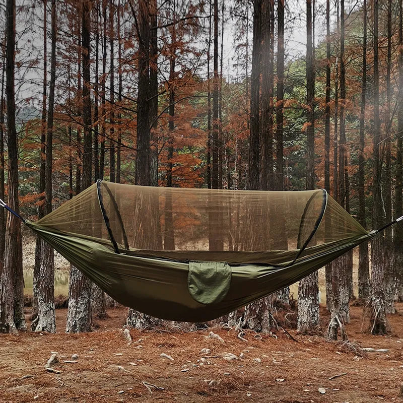 Unisex outdoor camping hammock with integrated mosquito net for bug-free relaxation. Portable & lightweight travel gear.