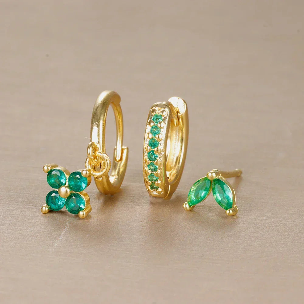 Close-up of a women's minimalist ear piercing set, showcasing comfortable surgical steel studs & hoops.