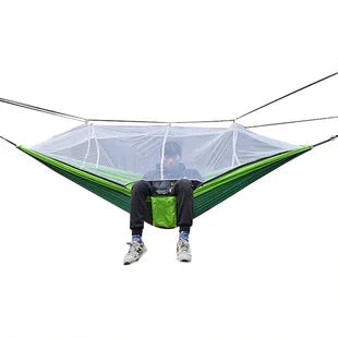 Essential lightweight camping hammock with a bug net, designed for hiking, outdoor relaxation, and adventure.