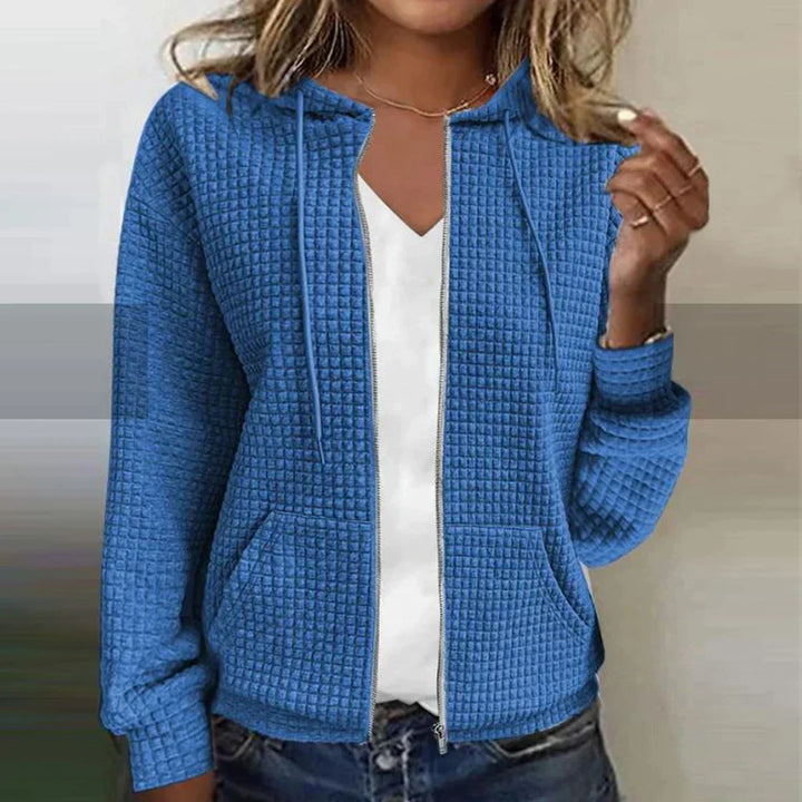 Comfortable women's checked water-repellent jacket. Warm layering piece, stylish casual outerwear.