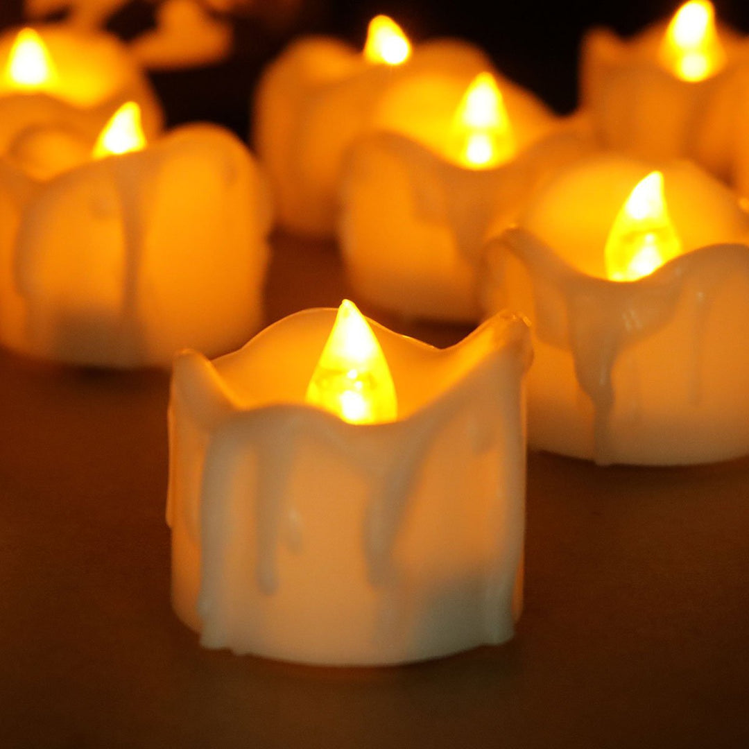 12-pack of decorative flameless LED candles, battery operated for long-lasting, safe mood lighting & event decor.