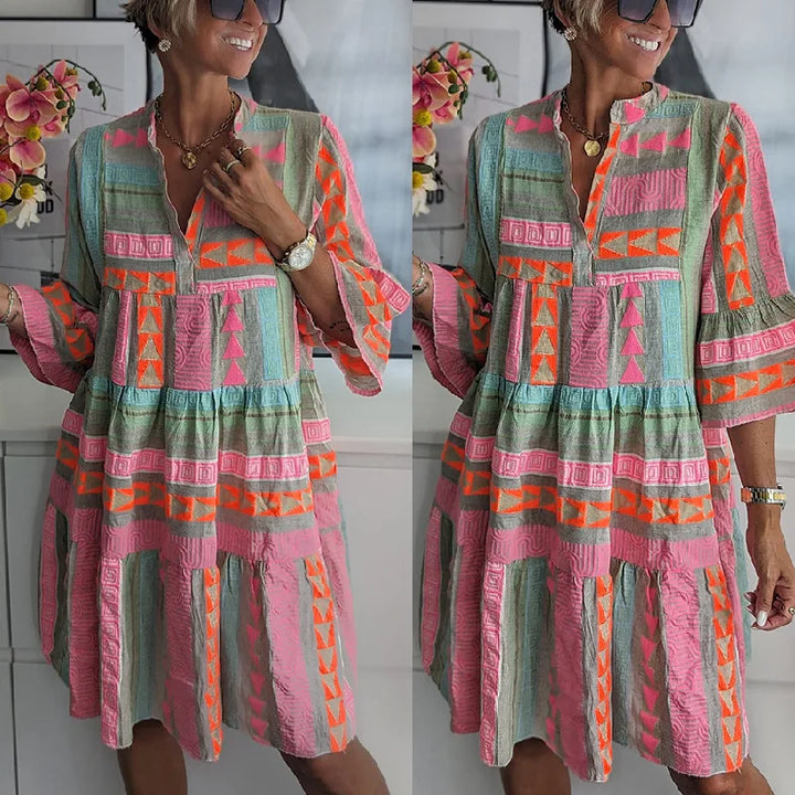 Feminine pink A-line dress with charming ruffles, a short hem, and elegant design for women's spring fashion.