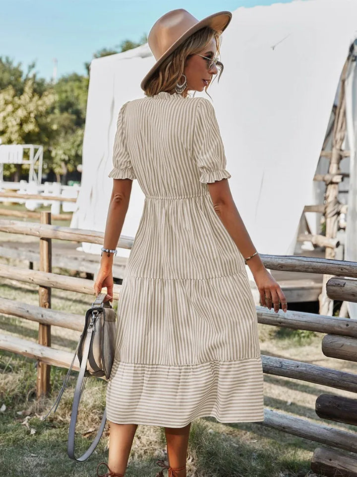 Flowy women's V-neck dress with ruffles, offering effortless chic for any casual or semi-formal occasion.