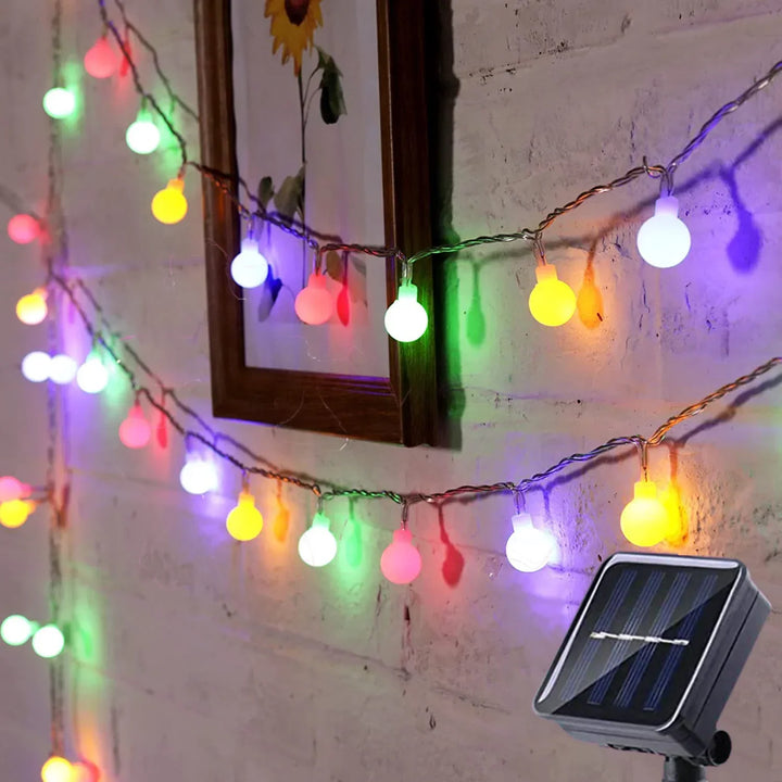 Waterproof solar LED string lights providing decorative, eco-friendly outdoor lighting for patios & gardens.