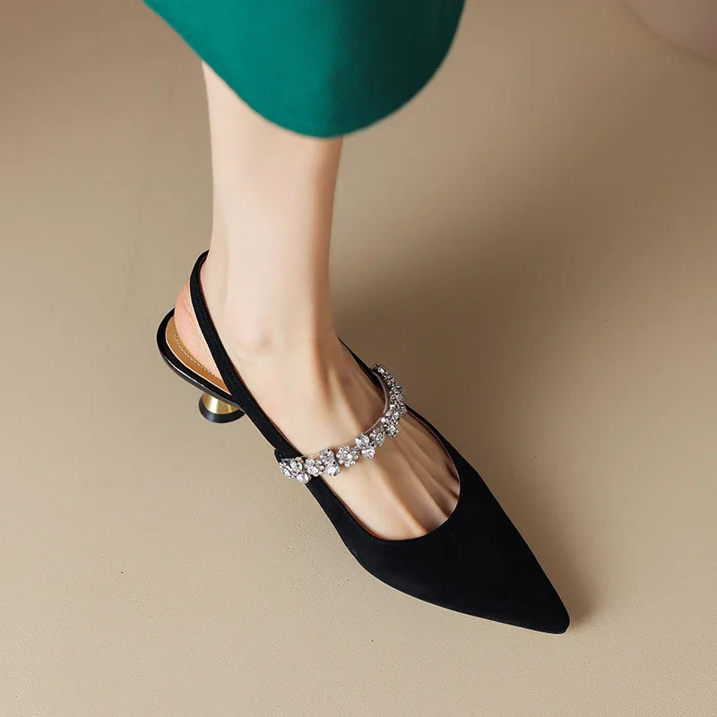 Crystal-embellished low heel pumps for women, a sleek pointed toe slingback design in silver.
