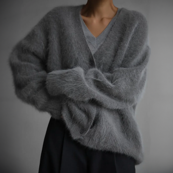 Sparkling crystal details on a women's cozy knit cardigan. Chic long sleeve layering piece.