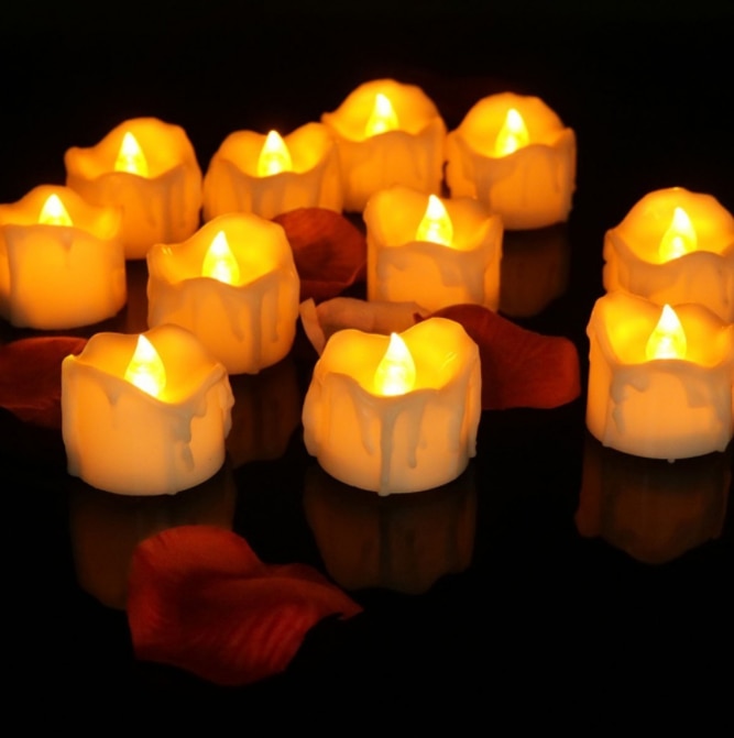 Flickering flameless LED candles, battery-operated for versatile indoor home decor, safe alternative to real flames.