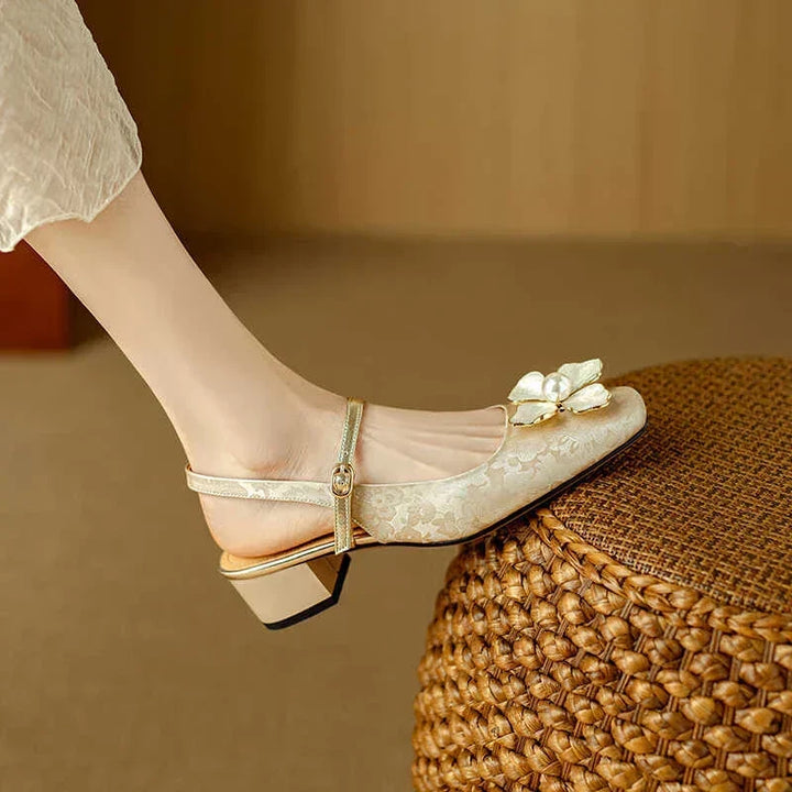 Pointed-toe floral jacquard block-heel pumps, offering elegant style & comfort for women.