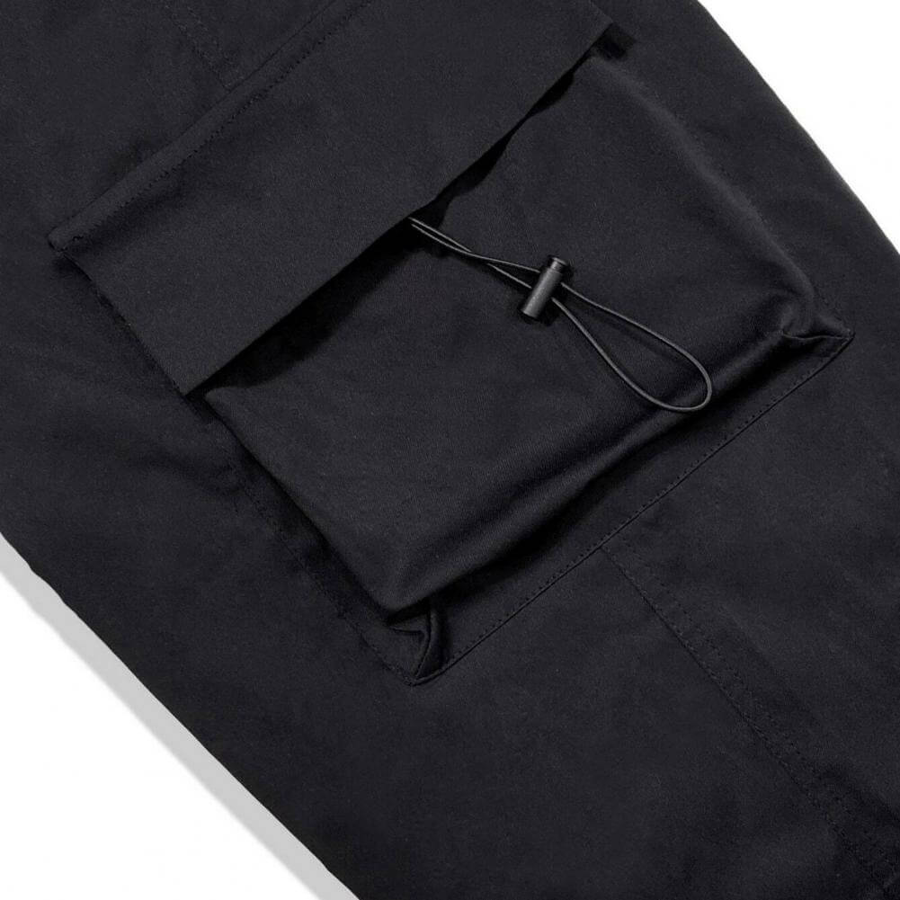 Streetwear-ready black cargo joggers, relaxed fit unisex design in soft polyester for all-day wear.