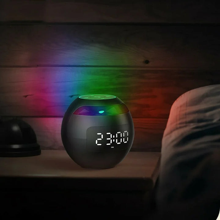 Compact bedside digital alarm clock with Bluetooth speaker, LED night light, and contemporary design.