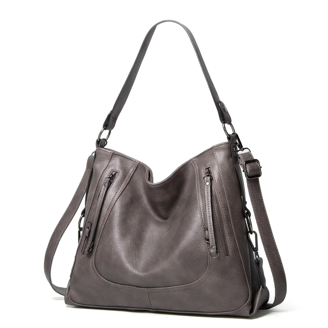 Brown vintage leather shoulder bag for women, spacious & stylish everyday handbag. Premium quality fashion.