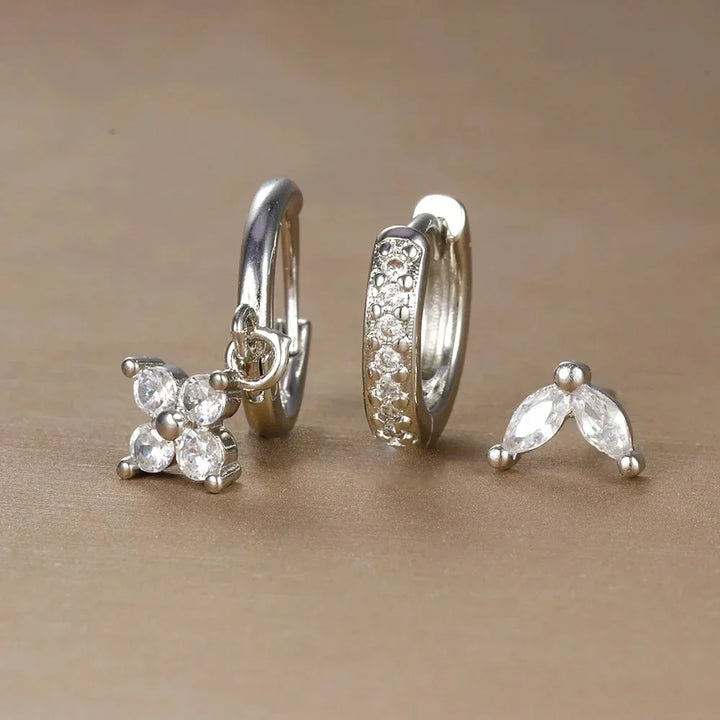 Minimalist women's ear piercing collection, a hypoallergenic surgical steel set of hoops & studs for everyday wear.
