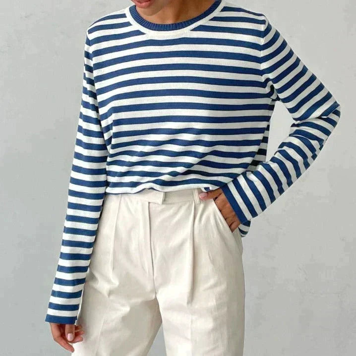 Back of women's striped knit sweater. Classic long sleeve crew neck pullover style, a versatile fashion piece.